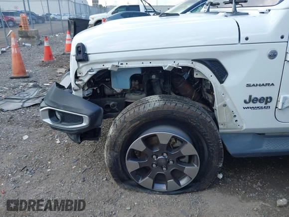 2018 Jeep Wrangler Unlimited Sahara with VIN 1C4HJXEG1JW205789, listed as a IAAI auction lot 42435877 with 57,587 mi miles and . Bid and sale history available at DreamBid. Image 6.