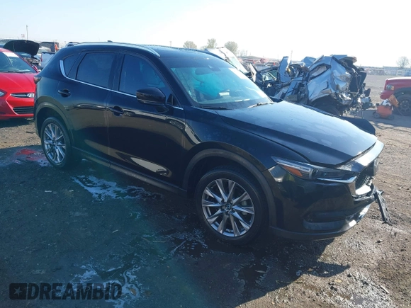 2020 Mazda CX-5 Grand Touring with VIN JM3KFBDM0L0790508, listed as a IAAI auction lot 41883319 with 114,398 mi miles and . Bid and sale history available at carsss.com. Image 1.