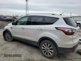 2017 Ford Escape Titanium with VIN 1FMCU0JD1HUE66040, listed as a Copart auction lot 43942665 with 55,484 mi miles and Salvage Title. Bid and sale history available at DreamBid. Image 2.