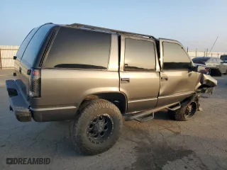 1999 Chevrolet Tahoe with VIN 1GNEC13R0XJ495650, listed as a Copart auction lot 85348144 with 0 mi miles and Salvage Title. Bid and sale history available at carsss.com. Image 3.