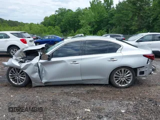 2019 Infiniti Q50 Luxe z VIN JN1EV7AP6KM512713, wystawiony jako IAAI lot #42151445 z przebiegiem Nie podano mil oraz . Historia ofert i sprzedaży dostępna na DreamBid. Obrazek 14.