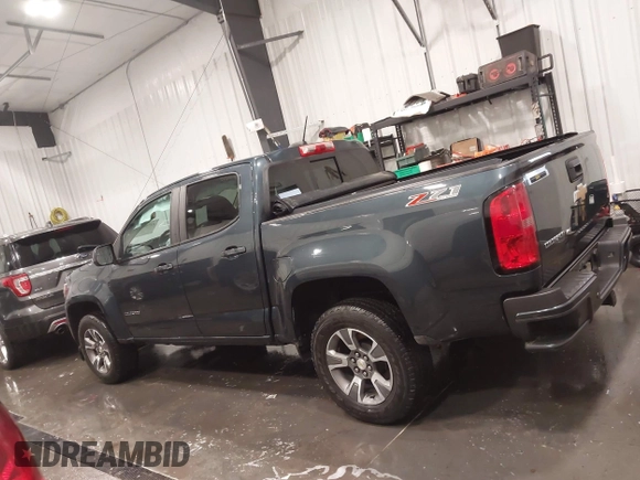 2020 Chevrolet Colorado 4WD Z71 with VIN 1GCGTDEN1L1163546, listed as a IAAI auction lot 41706719 with 64,662 mi miles and . Bid and sale history available at DreamBid. Image 14.