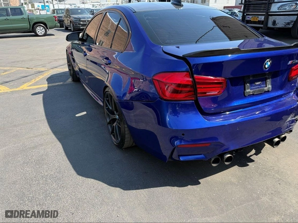 2018 BMW M3 with VIN WBS8M9C59J5L71951, listed as a IAAI auction lot 42129203 with 50,011 mi miles. Bid and sale history available at carsss.com. Image 3.