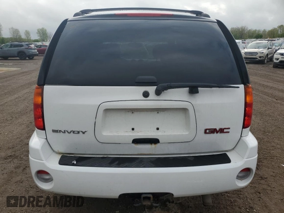 2007 GMC Envoy SLE z VIN 1GKDT13S272124785, wystawiony jako Copart lot #56509515 z przebiegiem 111 960 mil mil oraz Czysty tytuł • Clean title. Historia ofert i sprzedaży dostępna na DreamBid. Obrazek 6.