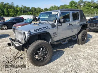 2015 Jeep Wrangler Unlimited Sport with VIN 1C4BJWDGXFL521492, listed as a Copart auction lot 61573025 with 128,153 mi miles and Salvage title. Bid and sale history available at DreamBid. Image 1.
