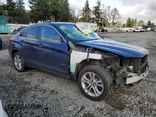2015 BMW X4 xDrive28i with VIN 5UXXW3C52F0M87375, listed as a Copart auction lot 41140544 with 123,818 mi miles. Bid and sale history available at carsss.com. Image 4.