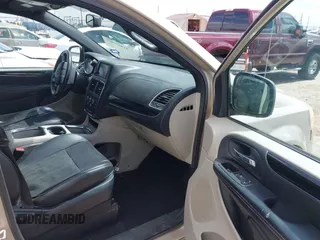 2014 Dodge Grand Caravan SXT with VIN 2C4RDGCG6ER466459, listed as a IAAI auction lot 41820907 with 105,404 mi miles and . Bid and sale history available at DreamBid. Image 5.