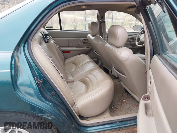 1998 Buick Century Limited with VIN 2G4WY52MXW1573044, listed as a IAAI auction lot 41967391 with 142,169 mi miles. Bid and sale history available at carsss.com. Image 8.