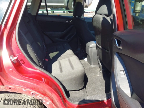 2014 Mazda CX-5 Touring with VIN JM3KE2CY2E0374440, listed as a IAAI auction lot 41634144 with 106,145 mi miles and . Bid and sale history available at DreamBid. Image 8.