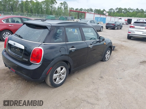 2015 MINI Hardtop 4 Door z VIN WMWXS5C58FT828427, wystawiony jako IAAI lot #42395620 z przebiegiem 102 282 mil mil oraz . Historia ofert i sprzedaży dostępna na DreamBid. Obrazek 4.