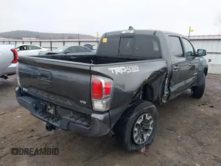 2022 Toyota Tacoma SR with VIN 3TMCZ5AN4NM476170, listed as a IAAI auction lot 41482149 with 57,126 mi miles and . Bid and sale history available at DreamBid. Image 4.