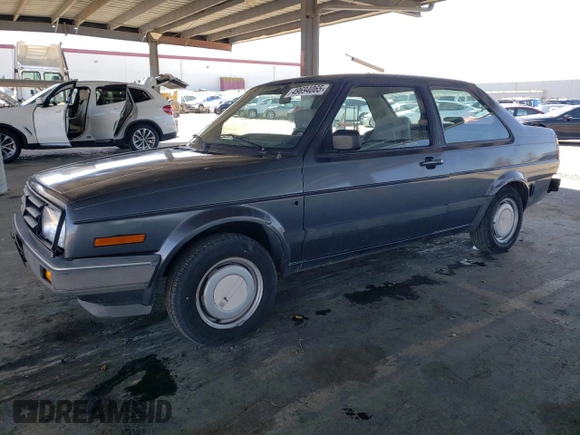 1989 Volkswagen Jetta z VIN WVWKB01G2KW684385, wystawiony jako Copart lot #49694065 z przebiegiem 63 792 mil mil oraz Czysty tytuł • Clean title. Historia ofert i sprzedaży dostępna na DreamBid. Obrazek 1.