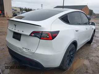 2021 Tesla Model Y Standard Range with VIN 5YJYGDED8MF114076, listed as a IAAI auction lot 41567295 with 150,133 mi miles and . Bid and sale history available at DreamBid. Image 4.