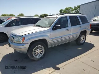2002 Jeep Grand Cherokee Limited with VIN 1J8GW58N62C277031, listed as a Copart auction lot 52234555 with 156,311 mi miles and Salvage title. Bid and sale history available at DreamBid. Image 1.