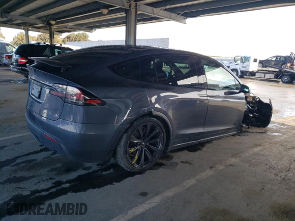 2023 Tesla Model X with VIN 7SAXCDE55PF410146, listed as a Copart auction lot 48818085 with 26,494 mi miles and Salvage Title. Bid and sale history available at DreamBid. Image 3.