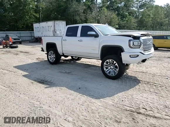 2017 GMC Sierra 1500 Denali z VIN 3GTU2PEJ2HG433669, wystawiony jako Copart lot #57460285 z przebiegiem 131 113 mil mil oraz Szkoda całkowita • Salvage title. Historia ofert i sprzedaży dostępna na DreamBid. Obrazek 14.