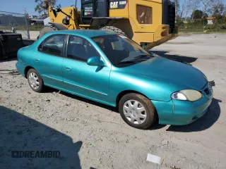 2000 Hyundai Elantra GLS z VIN KMHJF35FXYU998689, wystawiony jako Copart lot #76181814 z przebiegiem 154 743 mil mil oraz Szkoda całkowita • Salvage title. Historia ofert i sprzedaży dostępna na DreamBid. Obrazek 4.