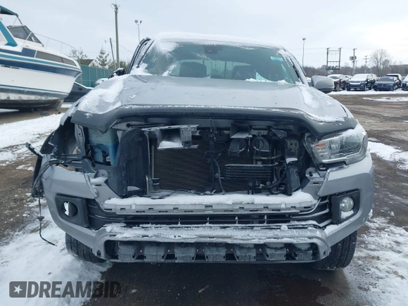 2019 Toyota Tacoma SR z VIN 3TMCZ5AN8KM211246, wystawiony jako IAAI lot #41574346 z przebiegiem 66 825 mil mil oraz . Historia ofert i sprzedaży dostępna na DreamBid. Obrazek 13.