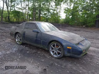 1989 Nissan 300ZX z VIN JN1HZ14S7KX290051, wystawiony jako IAAI lot #42203078 z przebiegiem 136 643 mil mil oraz . Historia ofert i sprzedaży dostępna na DreamBid. Obrazek 1.