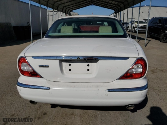 2005 Jaguar XJ with VIN SAJWA79C35SG48607, listed as a Copart auction lot 77132444 with 159,051 mi miles and Salvage Title. Bid and sale history available at carsss.com. Image 6.