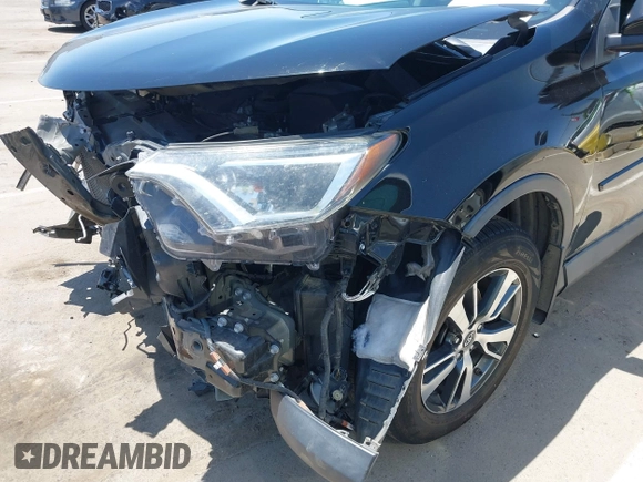 2018 Toyota RAV4 XLE with VIN 2T3WFREV2JW447623, listed as a IAAI auction lot 42410168 with 84,800 mi miles and . Bid and sale history available at DreamBid. Image 17.