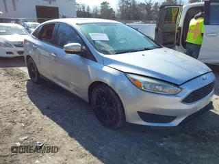 2015 Ford Focus SE z VIN 1FADP3F24FL329157, wystawiony jako IAAI lot #41997154 z przebiegiem 95 650 mil mil oraz . Historia ofert i sprzedaży dostępna na DreamBid. Obrazek 1.