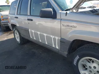 1994 Jeep Grand Cherokee Laredo with VIN 1J4GZ58S4RC325909, listed as a IAAI auction lot 39580601 with 162,952 mi miles. Bid and sale history available at carsss.com. Image 12.