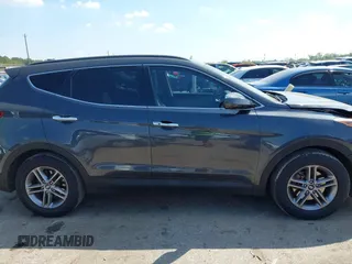2017 Hyundai Santa Fe 2.4L z VIN 5XYZU3LB4HG462058, wystawiony jako IAAI lot #41861190 z przebiegiem 87 102 mil mil oraz . Historia ofert i sprzedaży dostępna na DreamBid. Obrazek 13.