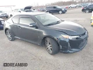 2015 Scion tC with VIN JTKJF5C7XFJ001662, listed as a IAAI auction lot 41843123 with 128,851 mi miles. Bid and sale history available at carsss.com. Image 1.