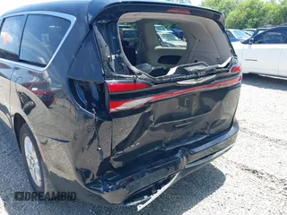 2023 Chrysler Pacifica Touring L with VIN 2C4RC1BG1PR606504, listed as a IAAI auction lot 42647652 with 41,598 mi miles and . Bid and sale history available at DreamBid. Image 18.