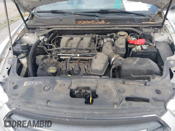2013 Ford Taurus SEL with VIN 1FAHP2E81DG129229, listed as a IAAI auction lot 41898917 with 205,865 mi miles. Bid and sale history available at carsss.com. Image 10.