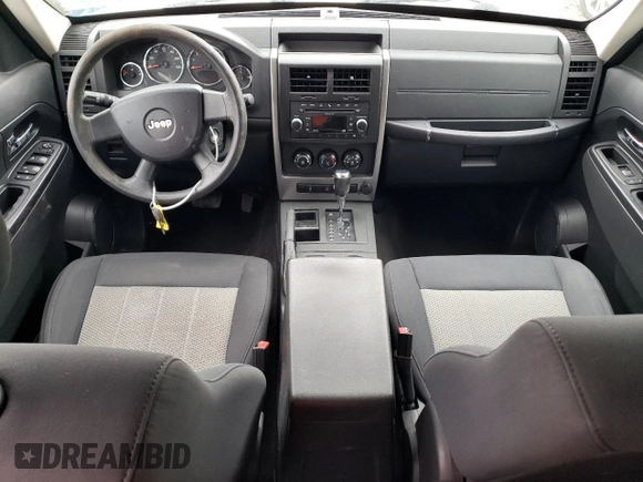 2010 Jeep Liberty Sport with VIN 1J4PP2GK9AW133958, listed as a Copart auction lot 47265675 with 124,466 mi miles and Salvage Title. Bid and sale history available at DreamBid. Image 8.