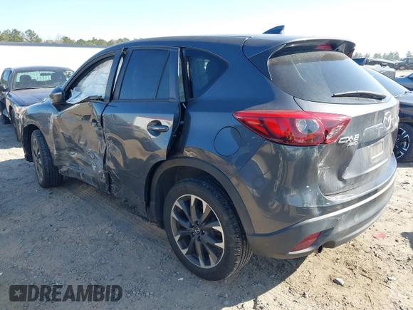 2016 Mazda CX-5 Grand Touring with VIN JM3KE4DY8G0823567, listed as a IAAI auction lot 41784384 with 143,836 mi miles and . Bid and sale history available at carsss.com. Image 3.