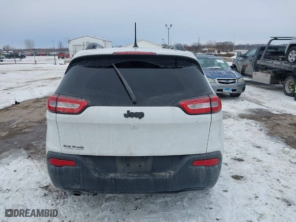 2016 Jeep Cherokee Altitude with VIN 1C4PJLAB4GW376723, listed as a IAAI auction lot 41593248 with 96,940 mi miles. Bid and sale history available at carsss.com. Image 16.