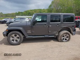 2017 Jeep Wrangler Unlimited Sahara with VIN 1C4BJWEGXHL595724, listed as a IAAI auction lot 42018264 with 95,948 mi miles. Bid and sale history available at carsss.com. Image 14.