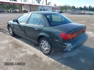 2000 Saturn SL z VIN 1G8ZK5271YZ165467, wystawiony jako IAAI lot #42367156 z przebiegiem 185 962 mil mil oraz . Historia ofert i sprzedaży dostępna na DreamBid. Obrazek 3.