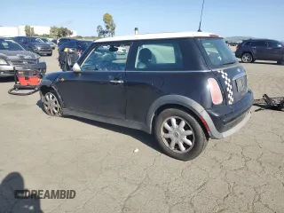 2004 MINI Hardtop with VIN WMWRC33464TJ62893, listed as a Copart auction lot 51905565 with 141,958 mi miles and Salvage Title. Bid and sale history available at DreamBid. Image 2.