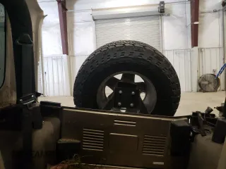 2004 Jeep Wrangler Rubicon z VIN 1J4FA69S44P784141, wystawiony jako Copart lot #55235305 z przebiegiem 125 564 mil mil oraz Szkoda całkowita • Salvage title. Historia ofert i sprzedaży dostępna na DreamBid. Obrazek 10.