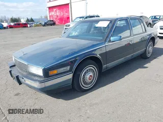 1986 Cadillac Seville z VIN 1G6KS6989GU813079, wystawiony jako IAAI lot #41732353 z przebiegiem Nie podano mil oraz . Historia ofert i sprzedaży dostępna na DreamBid. Obrazek 17.