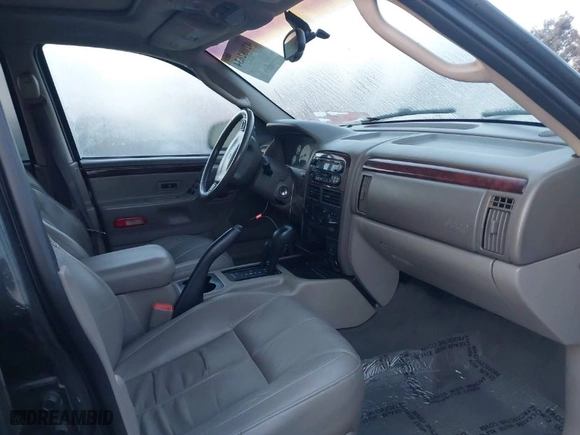 2002 Jeep Grand Cherokee Limited with VIN 1J8GW58NX2C327798, listed as a IAAI auction lot 42082634 with 167,863 mi miles. Bid and sale history available at carsss.com. Image 5.