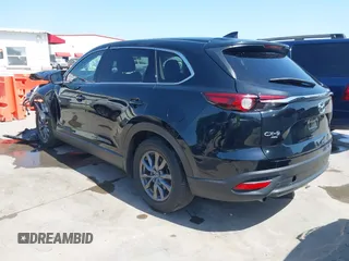 2023 Mazda CX-9 Touring with VIN JM3TCBCY2P0651679, listed as a IAAI auction lot 42002920 with 67,791 mi miles and . Bid and sale history available at DreamBid. Image 3.