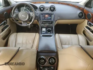 2014 Jaguar XJ with VIN SAJWA2GZ8E8V60138, listed as a Copart auction lot 86384064 with 137,190 mi miles and Salvage Title. Bid and sale history available at carsss.com. Image 8.