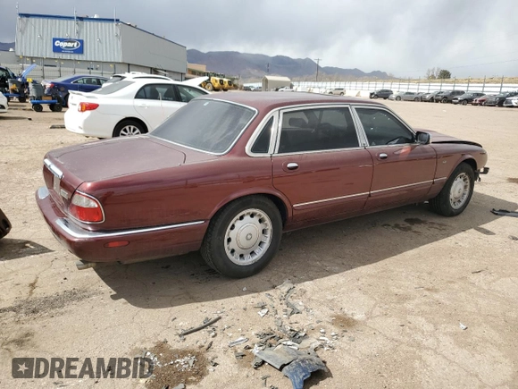 1998 Jaguar XJ Vanden Plas with VIN SAJKX6245WC830912, listed as a Copart auction lot 49717285 with 127,509 mi miles and Salvage Title. Bid and sale history available at DreamBid. Image 3.