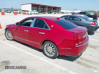 2012 Cadillac CTS Performance with VIN 1G6DJ5E31C0107905, listed as a IAAI auction lot 42131940 with 108,015 mi miles and . Bid and sale history available at DreamBid. Image 3.