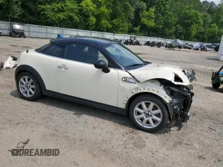 2014 MINI Coupe S z VIN WMWSX3C5XET409347, wystawiony jako Copart lot #56321384 z przebiegiem 81 070 mil mil oraz Szkody całkowita. Historia ofert i sprzedaży dostępna na DreamBid. Obrazek 4.