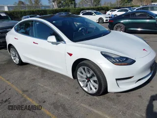 2018 Tesla Model 3 Long Range Battery with VIN 5YJ3E1EA0JF008351, listed as a IAAI auction lot 41129459 with 36,518 mi miles. Bid and sale history available at carsss.com. Image 1.