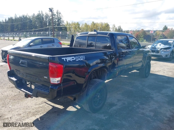 2016 Toyota Tacoma SR5 with VIN 5TFDZ5BN7GX001869, listed as a IAAI auction lot 40610002 with 184,380 mi miles. Bid and sale history available at carsss.com. Image 4.