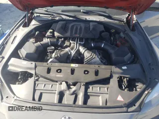 2015 BMW M6 z VIN WBS6C9C52FD467461, wystawiony jako Copart lot #68057084 z przebiegiem 130 687 mil mil oraz Szkoda całkowita • Salvage title. Historia ofert i sprzedaży dostępna na DreamBid. Obrazek 11.