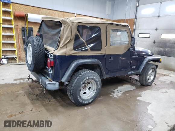 2000 Jeep Wrangler SE with VIN 1J4FA29P1YP739555, listed as a Copart auction lot 58501025 with 128,458 mi miles and Clean title. Bid and sale history available at DreamBid. Image 3.