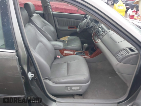 2005 Toyota Camry LE with VIN 4T1BF32K25U595176, listed as a IAAI auction lot 41932171 with 203,956 mi miles and . Bid and sale history available at DreamBid. Image 5.